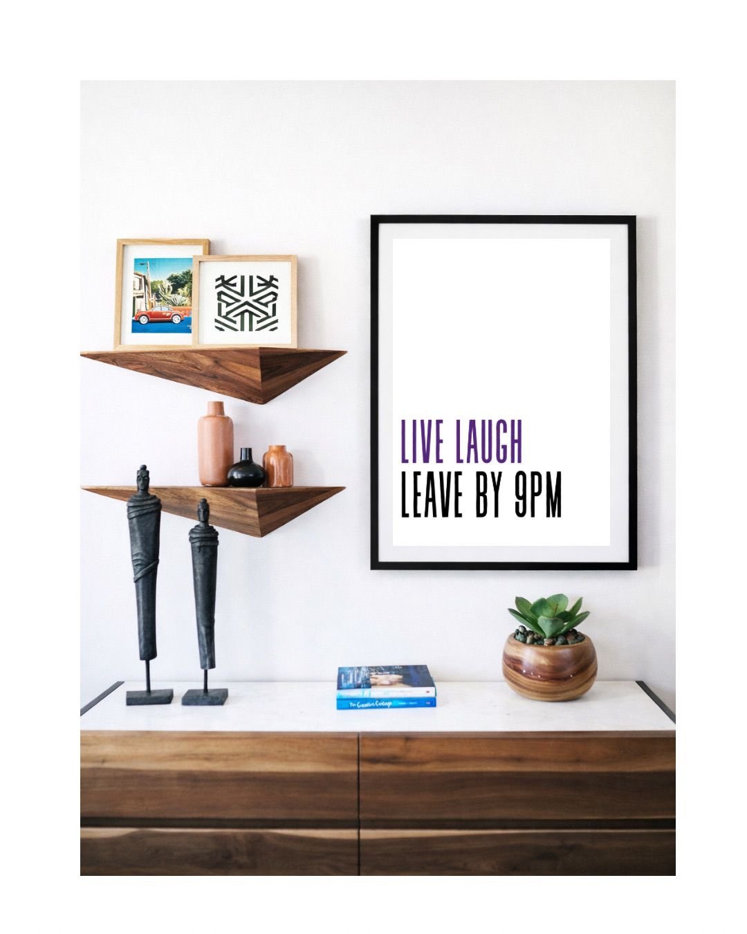 Framed Live Laugh print on a styled shelf